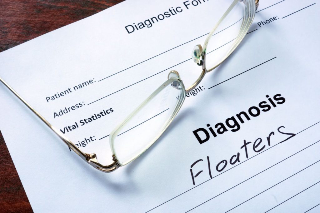 A piece of paper highlighting a diagnosis of floaters.