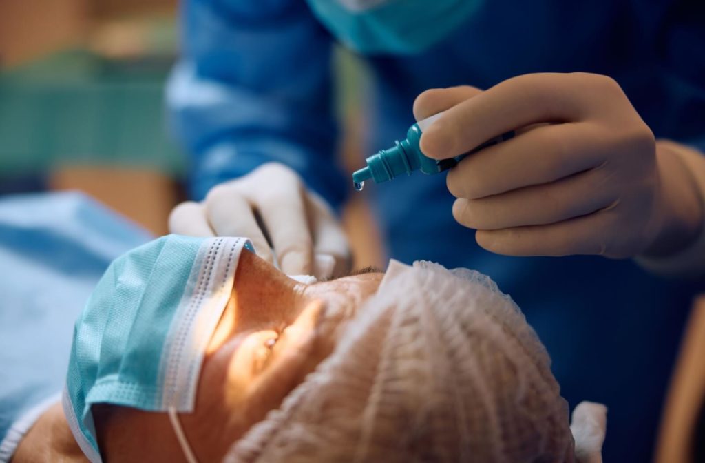 An ophthalmologist preparing their patient for cataract surgery.